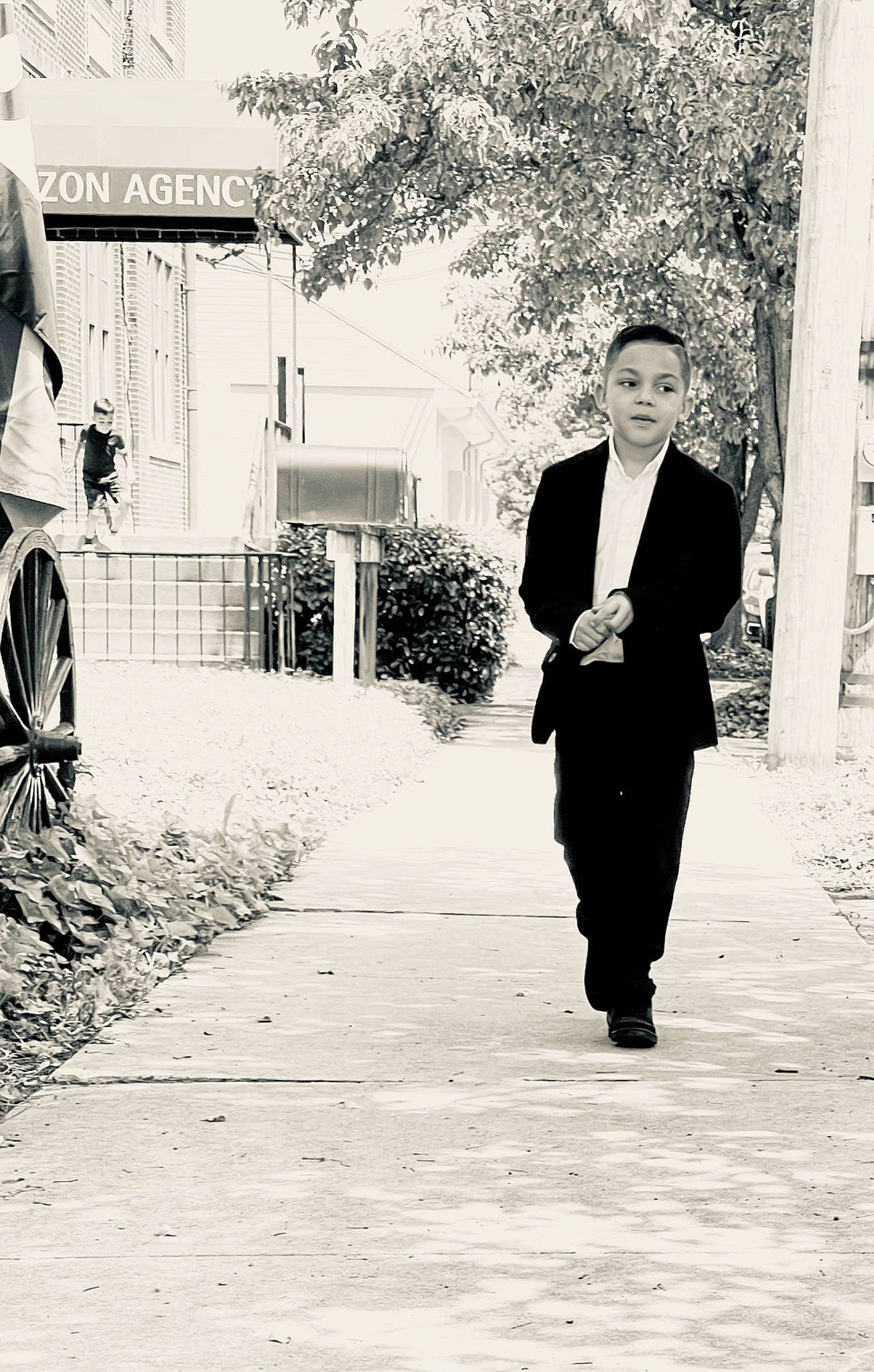 Dillan is registered to the contest to win money with this photo: asphalt, black_and_white, blazer, flash_photography, formal_wear, gesture, happy, human, monochrome, monochrome_photography, people_in_nature, person, plant, road, road_surface, standing, street, style, suit, tints_and_shades