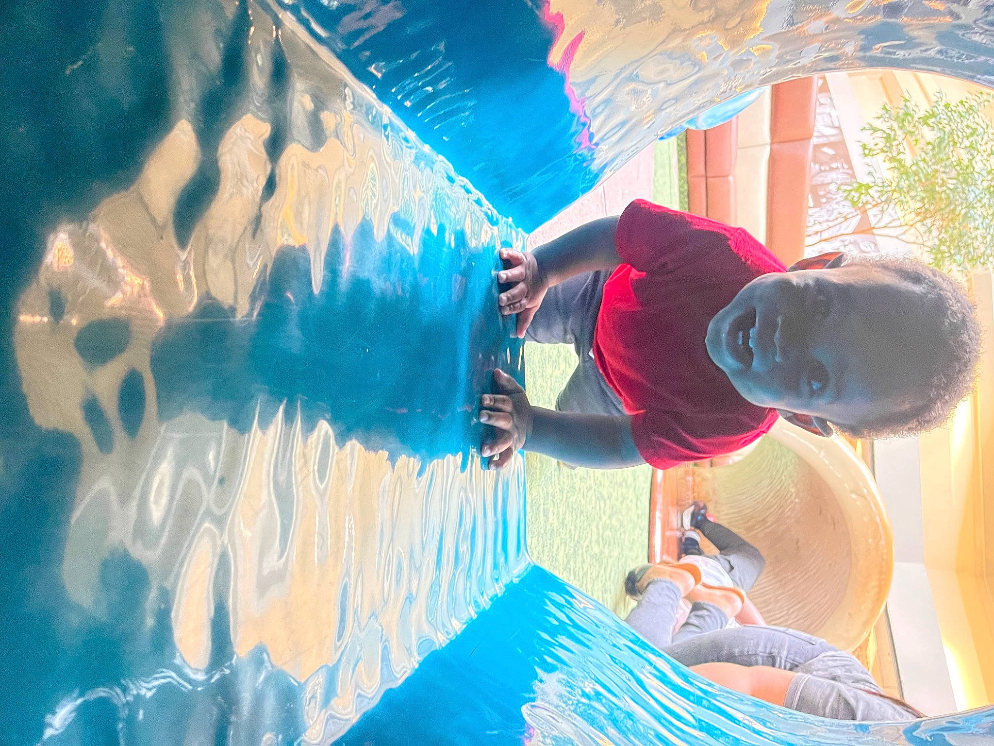 Atreus is registered to the contest to win money with this photo: art, azure, baseball_cap, child, electric_blue, fun, happy, hat, leisure, mural, paint, person, plant, plastic, recreation, t_shirt, tints_and_shades, vacation, visual_arts, water