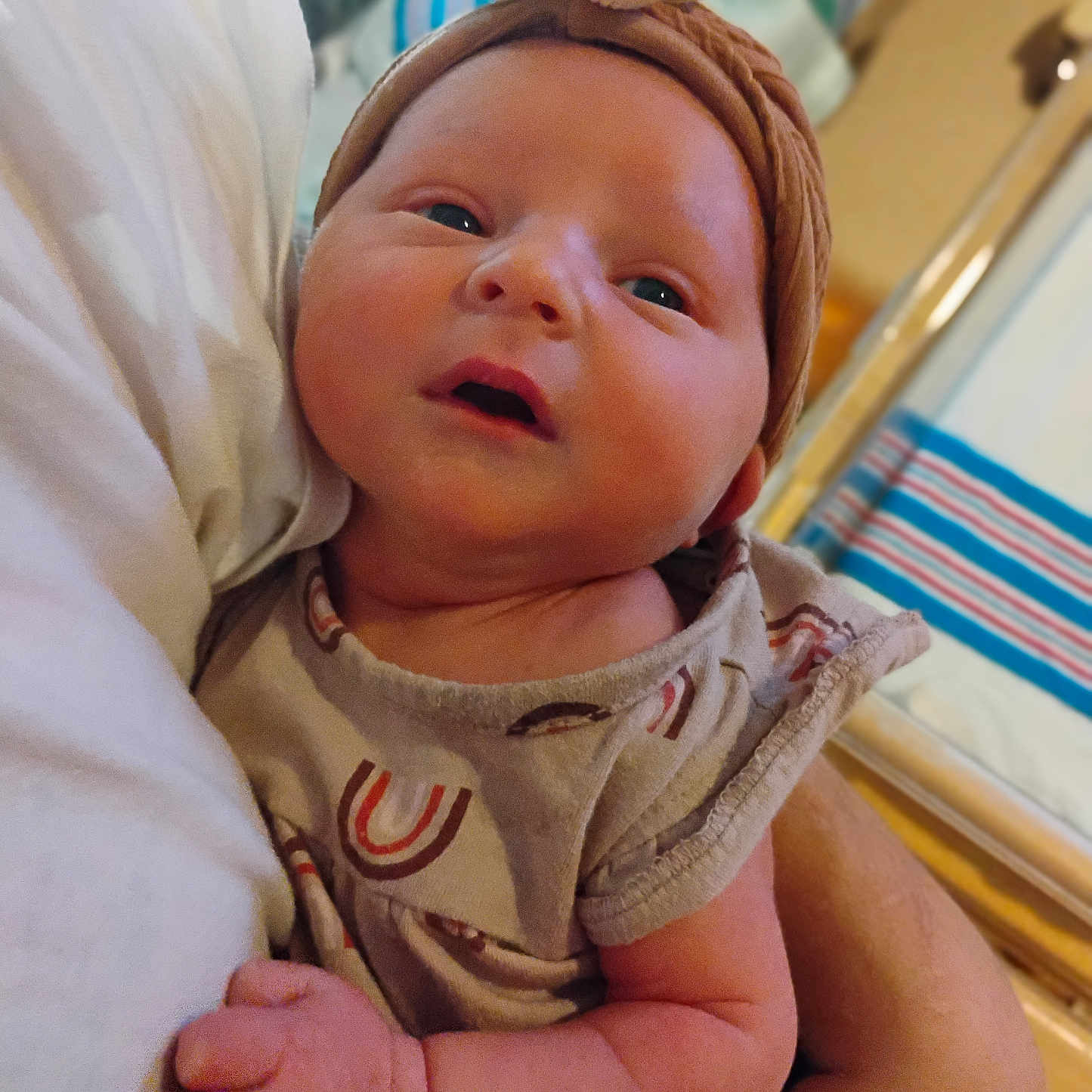 Myla Elizabeth Parks is registered to the contest to win money with this photo: accessories, baby, bodypart, bonnet, cap, clothing, face, finger, glove, hand, hat, head, headband, mouth, newborn, person, photography, portrait, towel, wrist