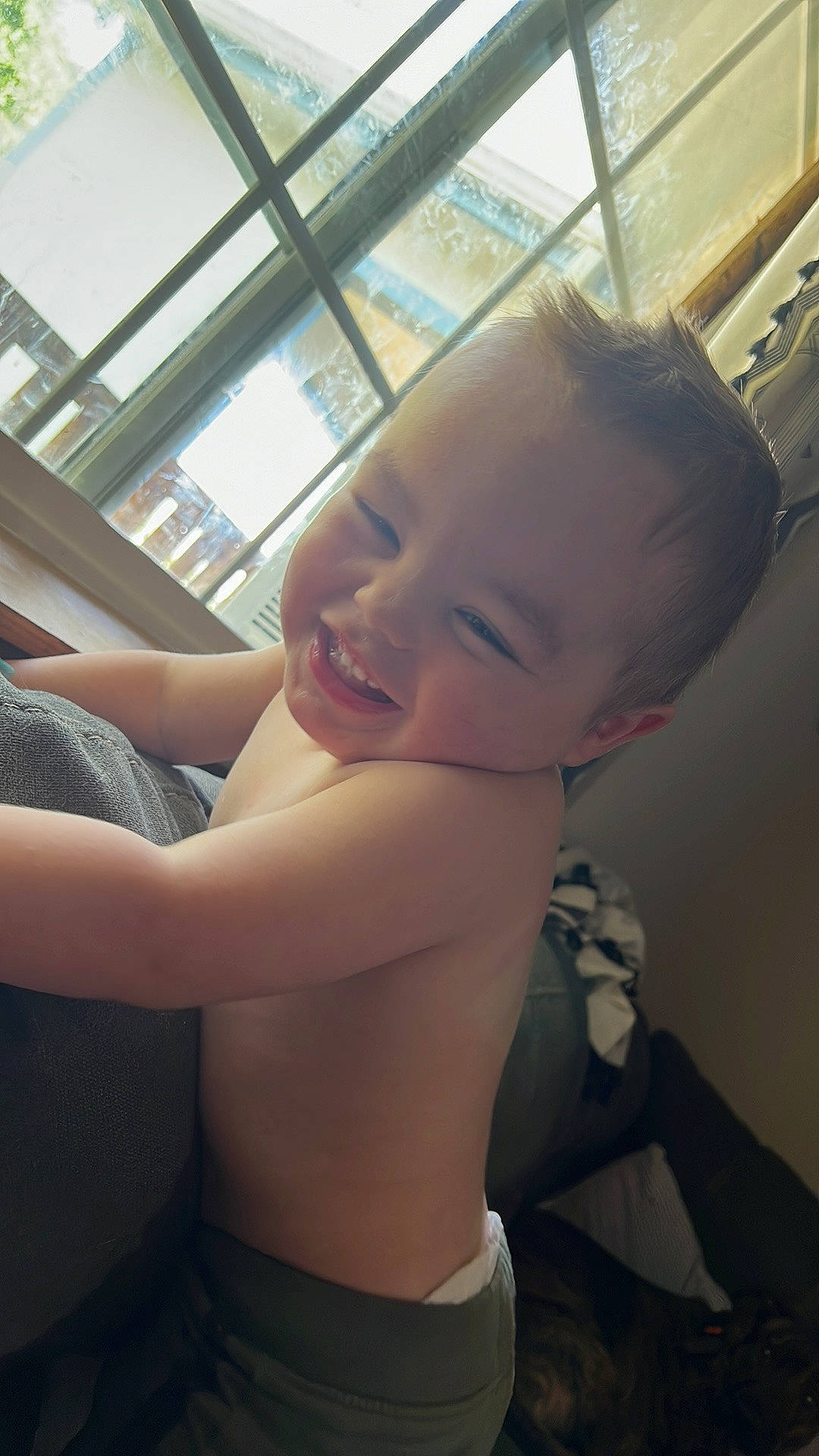 Archer is registered to the contest to win money with this photo: baby, black_hair, chest, comfort, elbow, facial_expression, finger, fun, happy, human, human_leg, joy, leg, lip, muscle, person, shoulder, skin, thigh, toddler