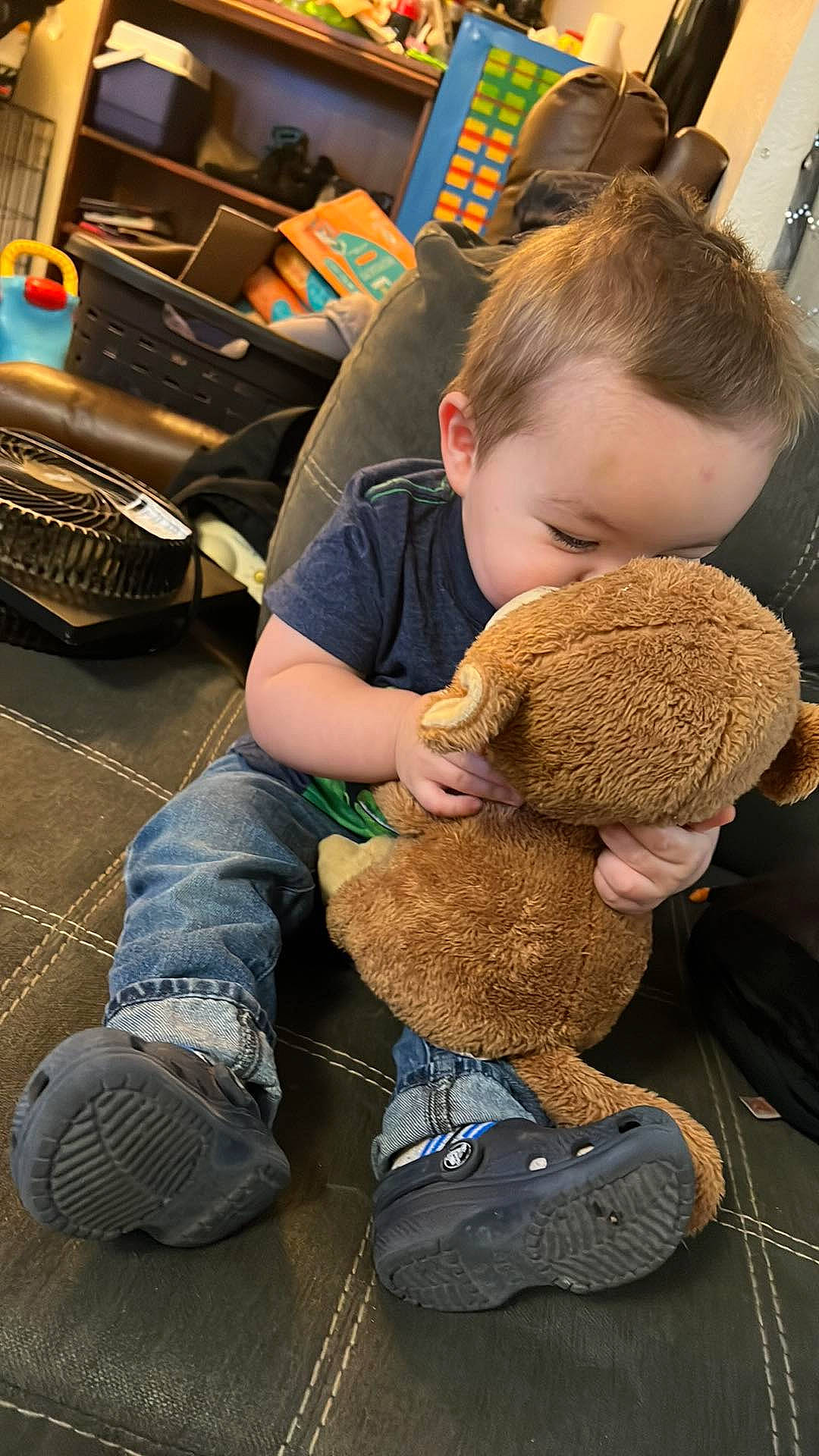 Archer joined the competition — help win amazing prizes! chair, child, denim, flooring, fun, fur, human_leg, person, plush, room, sitting, sneakers, stuffed_toy, toddler, toy, wool