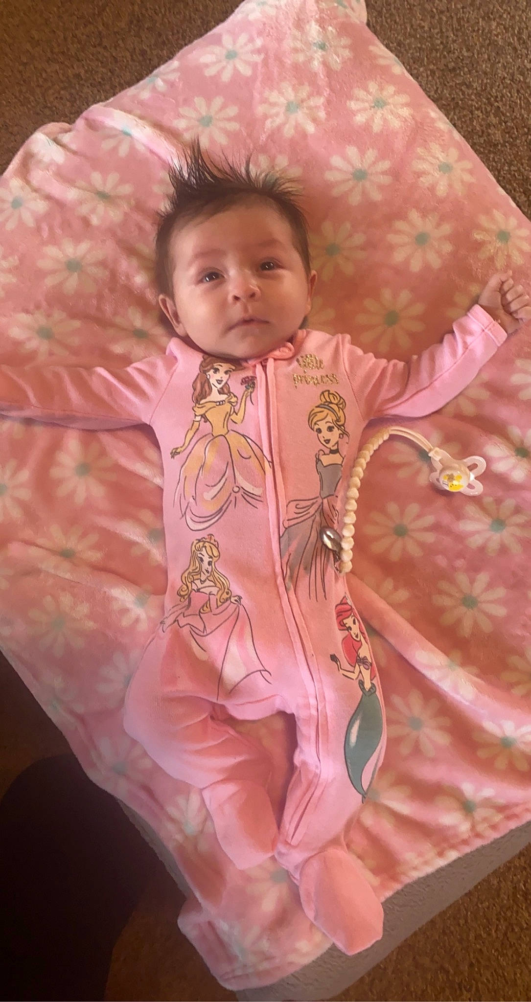 Brilynne is registered to the contest to win money with this photo: baby, baby_toddler_clothing, cheek, chest, child, eye, face, fashion_accessory, hair, head, linens, magenta, pattern, peach, person, pink, room, skin, sleeve, toddler