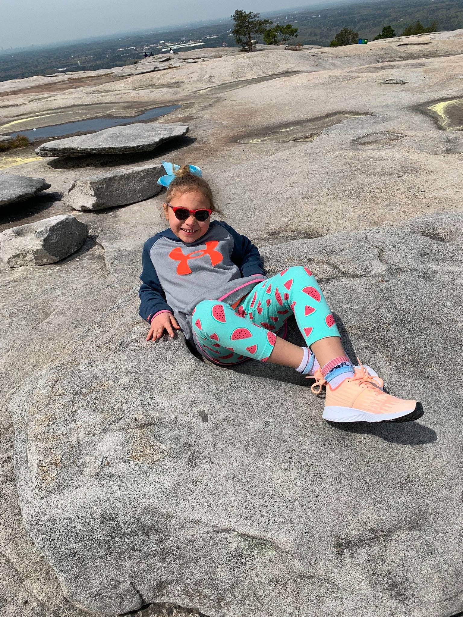 Izabelle is registered to the contest to win money with this photo: fun, joy, leisure, person, photography, rock, sitting, tourism, vacation