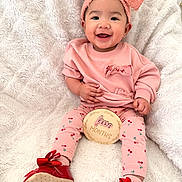 Elisha Jeanah joined the competition — help win amazing prizes! baby, infant, child, smiling, headband, bow, pink_clothing, cherry_print, milestone_disc, five_months, red_shoes, bow_shoes, cozy_blanket, sitting, portrait, happy, cute, earrings, small_hands, soft_texture