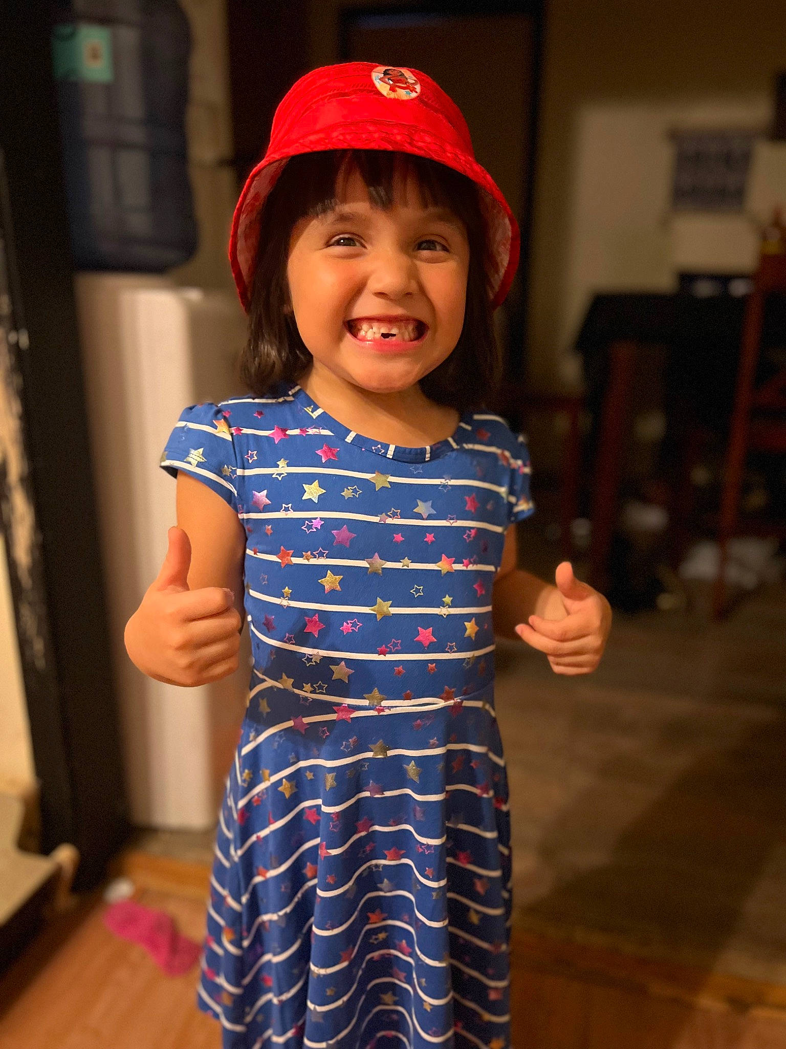 Dyana joined the competition — help win amazing prizes! baby_toddler_clothing, baseball_cap, cap, child, day_dress, electric_blue, face, gesture, happy, hat, headwear, human_body, joy, one_piece_garment, pattern, person, shoulder, sleeve, smile, thumb