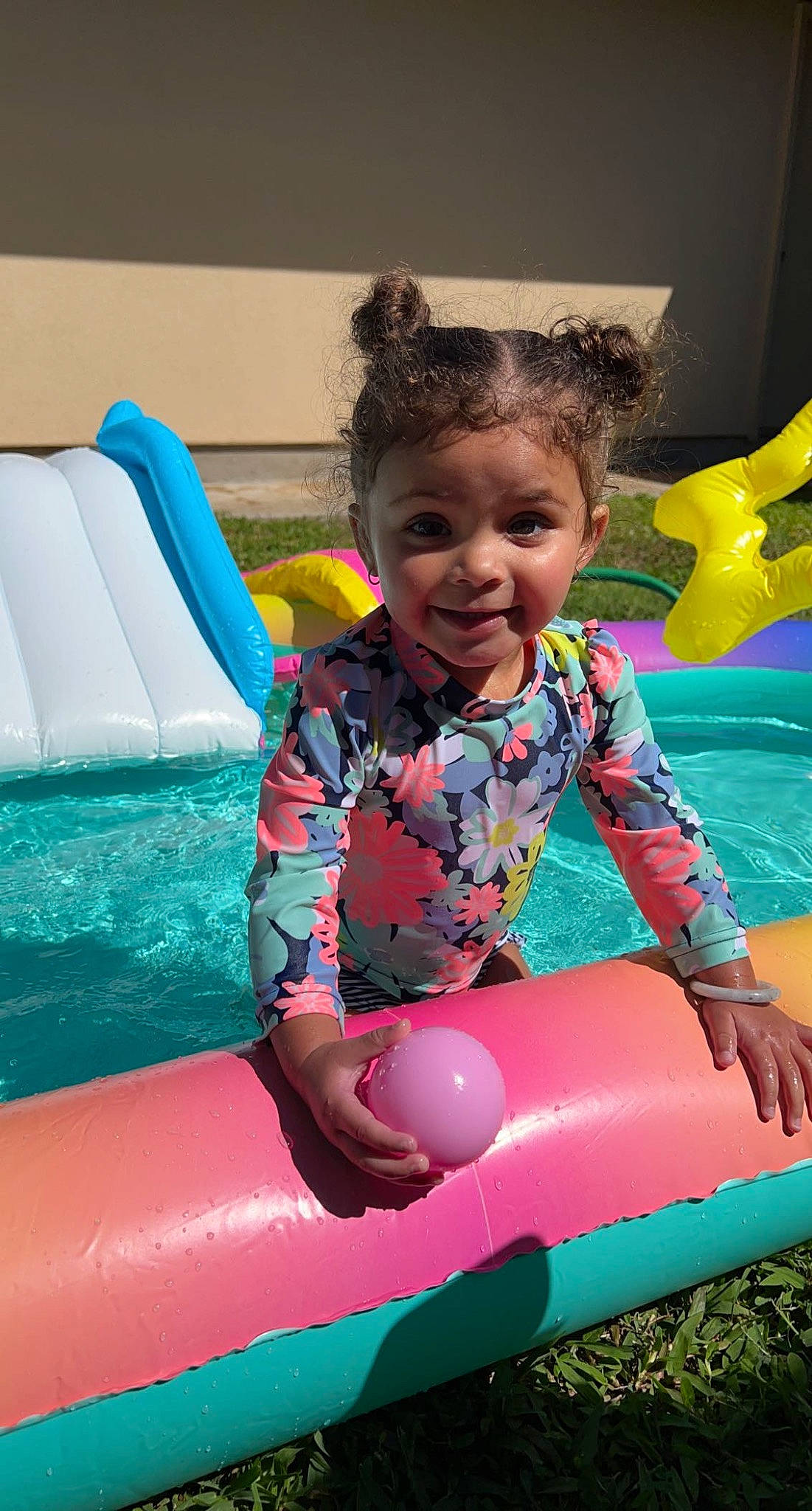 Karter Mae is registered to the contest to win money with this photo: baby_toddler_clothing, child, chute, fun, games, happy, inflatable, leisure, magenta, nonbuilding_structure, outdoor_play_equipment, person, photograph, pink, play, playground, recreation, sitting, smile, toddler