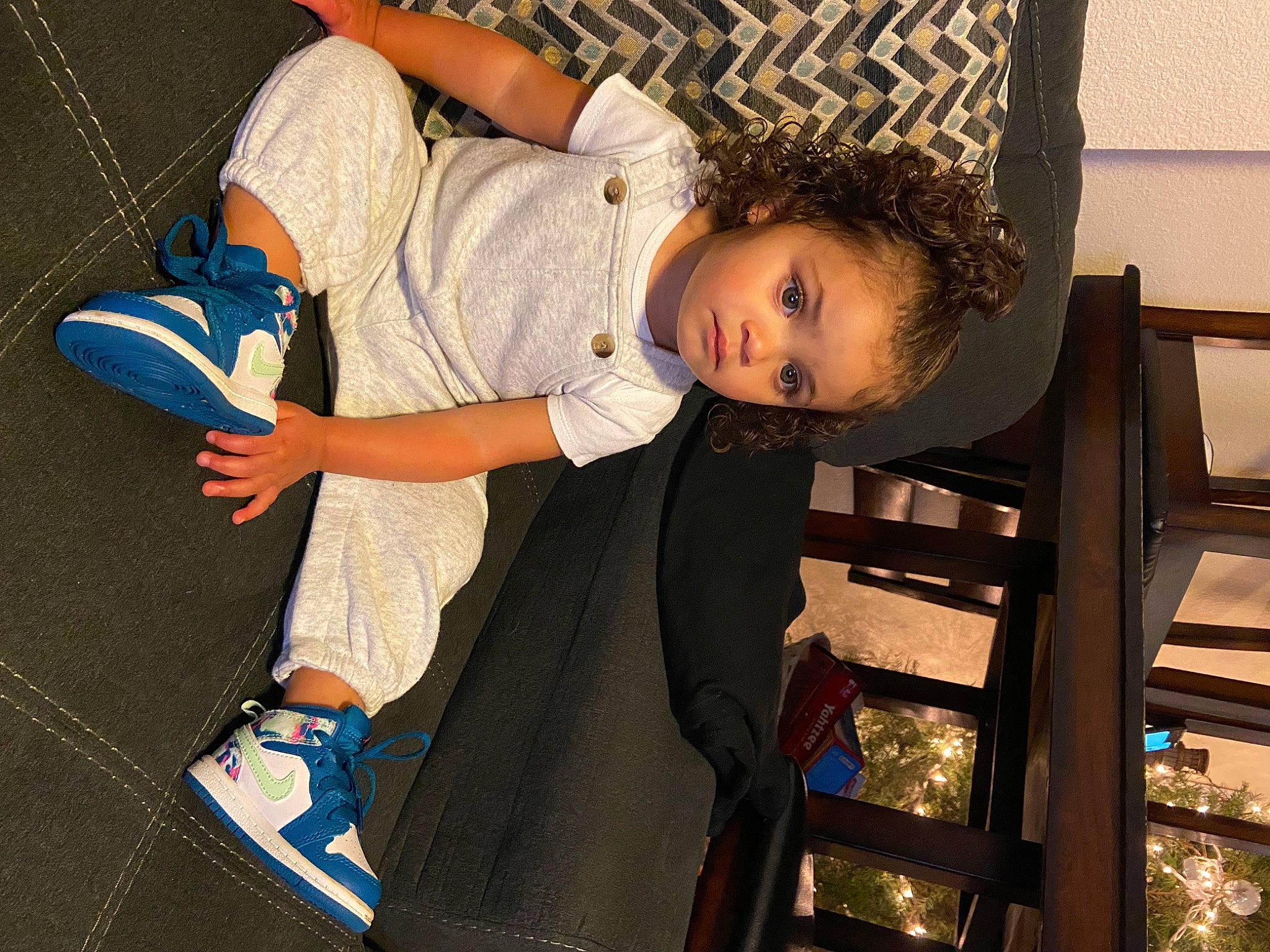 Karter Mae is registered to the contest to win money with this photo: carmine, child, comfort, denim, elbow, electric_blue, flooring, foot, fun, happy, human_leg, knee, leisure, pattern, person, sitting, t_shirt, thigh, toddler, walking_shoe