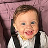 baby, blue_eyes, child, clothing, cute, expression, face, happy, indoors, infant, joyful, person, pink, portrait, safety_strap, seatbelt, sitting, smiling, stroller, young_child