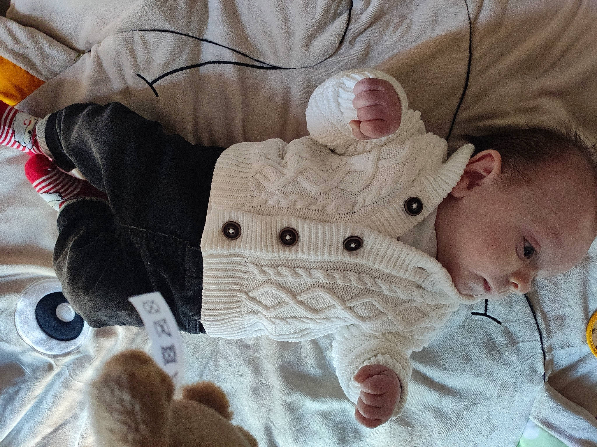 Nolan participe au concours pour gagner de l'argent avec cette photo : baby, baby_products, baby_sleeping, baby_toddler_clothing, cheek, child, comfort, fur, linens, pattern, person, product, skin, sleeve, stuffed_toy, textile, thumb, toddler, toy, white