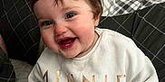 Maisie Elizabeth-Jay is registered to the contest to win money with this photo: architecture, baby, babylaughing, clothing, couch, cushion, face, furniture, happy, head, homedecor, indoors, laughing, pants, person, photography, portrait, sitting, smile, t_shirt