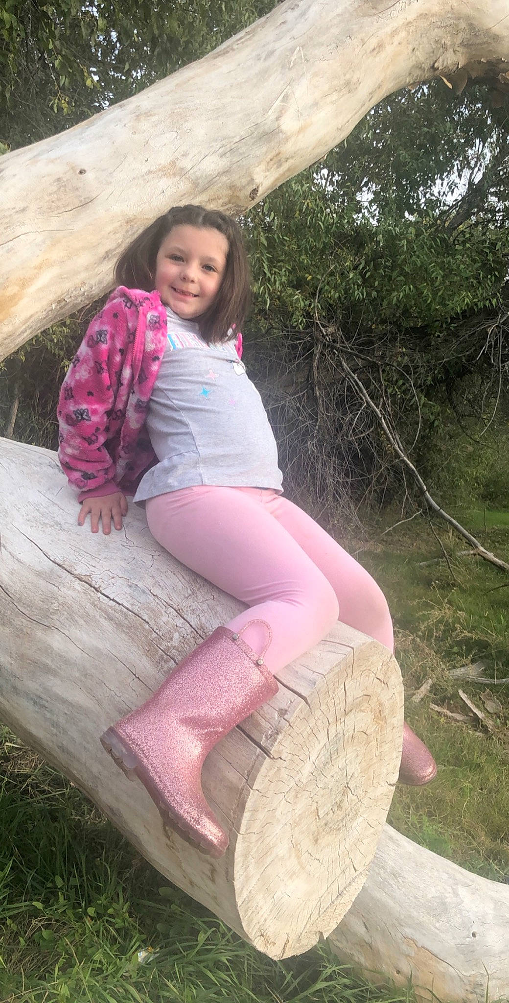 Paetyn joined the competition — help win amazing prizes! fawn, grass, joy, leg, leggings, leisure, long_hair, person, pink, plant, sitting, thigh, tights, tree