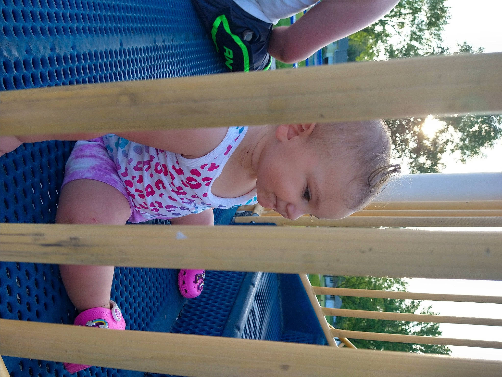 Alma is registered to the contest to win money with this photo: baby, baby_products, baby_toddler_clothing, blue, child, dress, fun, grass, happy, human_leg, leisure, line, pattern, person, skin, sky, summer, thigh, toddler, tree