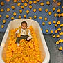 Zane joined the competition — help win amazing prizes! baby, bathtub, rubber_duck, toys, child, indoor, playful, yellow, seated, curious, carpet, walls, decor, cute, infant, clothing, white_bathtub, floor, expression, fun