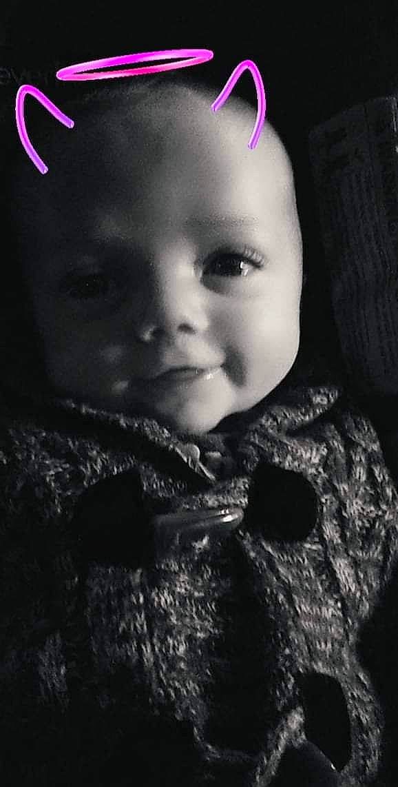 Sami is registered to the contest to win money with this photo: art, baby, baby_toddler_clothing, cheek, child, darkness, eyelash, fashion_accessory, flash_photography, fur, happy, lip, magenta, monochrome, monochrome_photography, nose, pattern, person, sleeve, smile