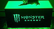 Smooshie is registered to the contest to win money with this photo: cat, animal, pet, feline, lying_down, relaxed, black_cat, green_lighting, neon, glowing, table, indoor, dark, dramatic_lighting, energy_drink, logo, brand, advertisement, portrait, nighttime