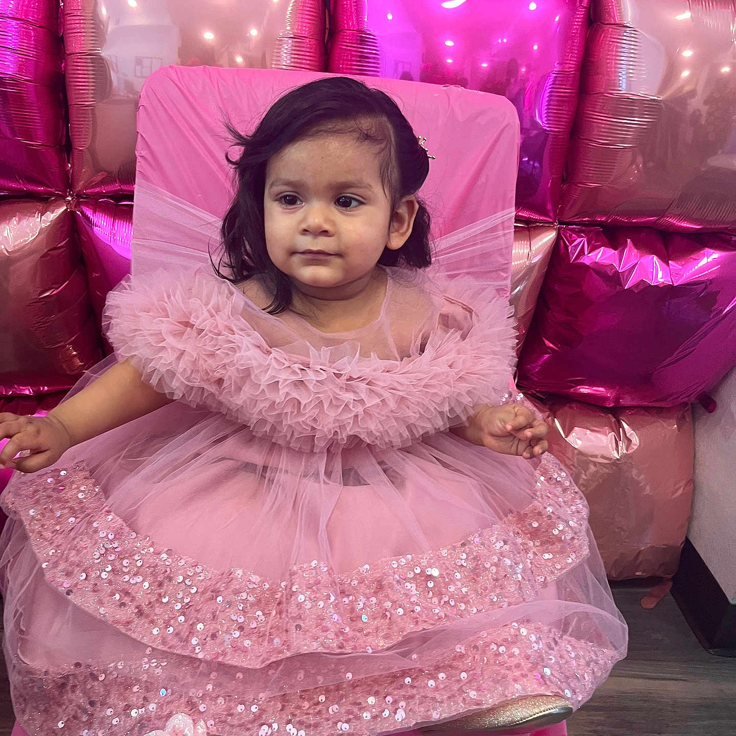 Laylah-Marie is registered to the contest to win money with this photo: balloons, celebration, chair, child, cute, decor, dress, face, female_child, flooring, footwear, hair, indoor, party, pink_dress, portrait, seated, shiny, sparkle, toddler