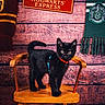 cat, black_cat, kitten, animal, pet, standing, chair, wooden_chair, indoors, portrait, wizarding_theme, hogwarts, harry_potter, platform_9_3_4, scarf, slytherin, wooden_background, costume, collar, photography