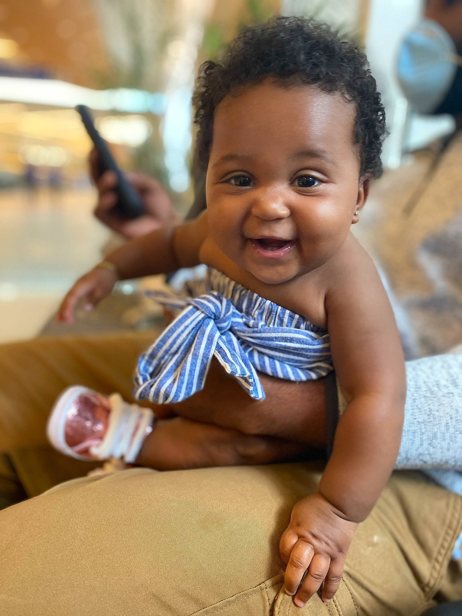 Cléo is registered to the contest to win money with this photo: adaptation, baby, cheek, child, face, facial_expression, fun, happy, human, people, person, sitting, skin, smile, toddler, vacation