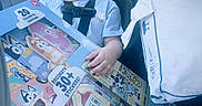 Ruby joined the competition — help win amazing prizes! toddler, child, car_seat, pacifier, sleeping, toy_box, crayons, stickers, pillow, car_interior, window, daylight, seatbelt, clothing, cute, young_child, relaxed, indoor, person, portrait
