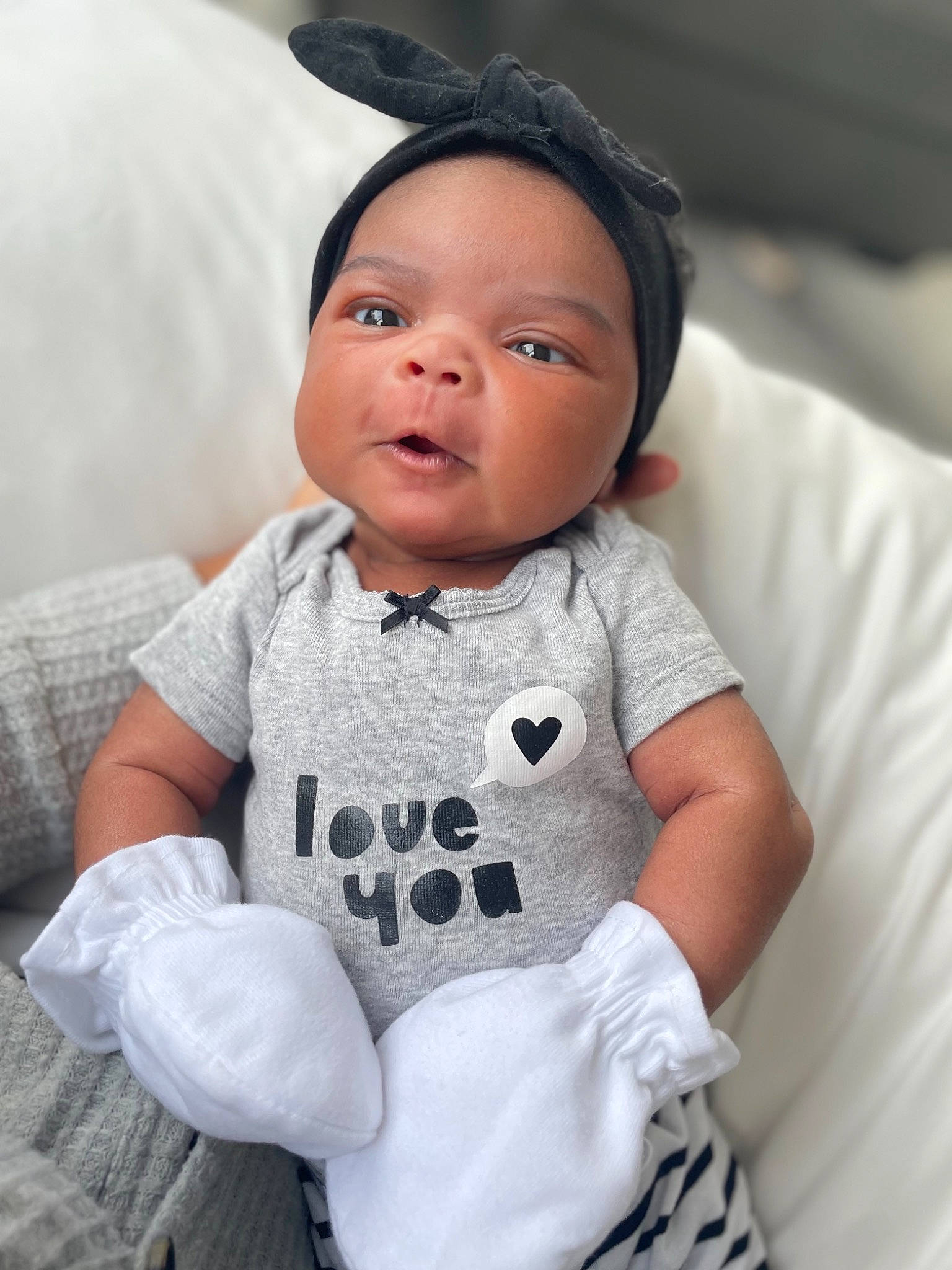 Nia is registered to the contest to win money with this photo: baby_toddler_clothing, cheek, collar, comfort, eye, eyelash, face, flash_photography, gesture, hair, happy, head, iris, lip, neck, nose, person, skin, sleeve, toddler