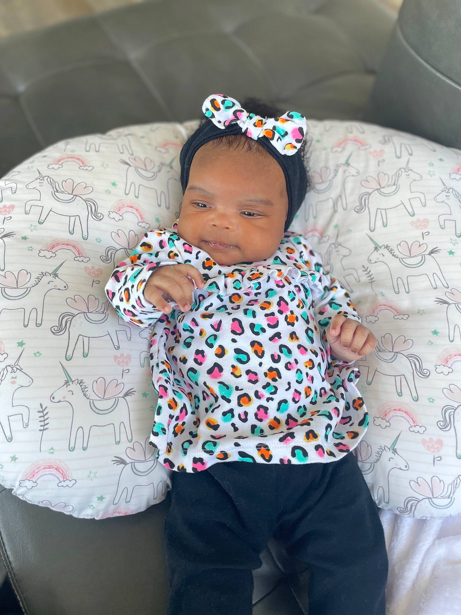 Nia joined the competition — help win amazing prizes! baby, baby_sleeping, baby_toddler_clothing, child, comfort, cool, couch, eye, hand, happy, headgear, human_body, mouth, pattern, person, pink, skin, sleeve, textile, thigh