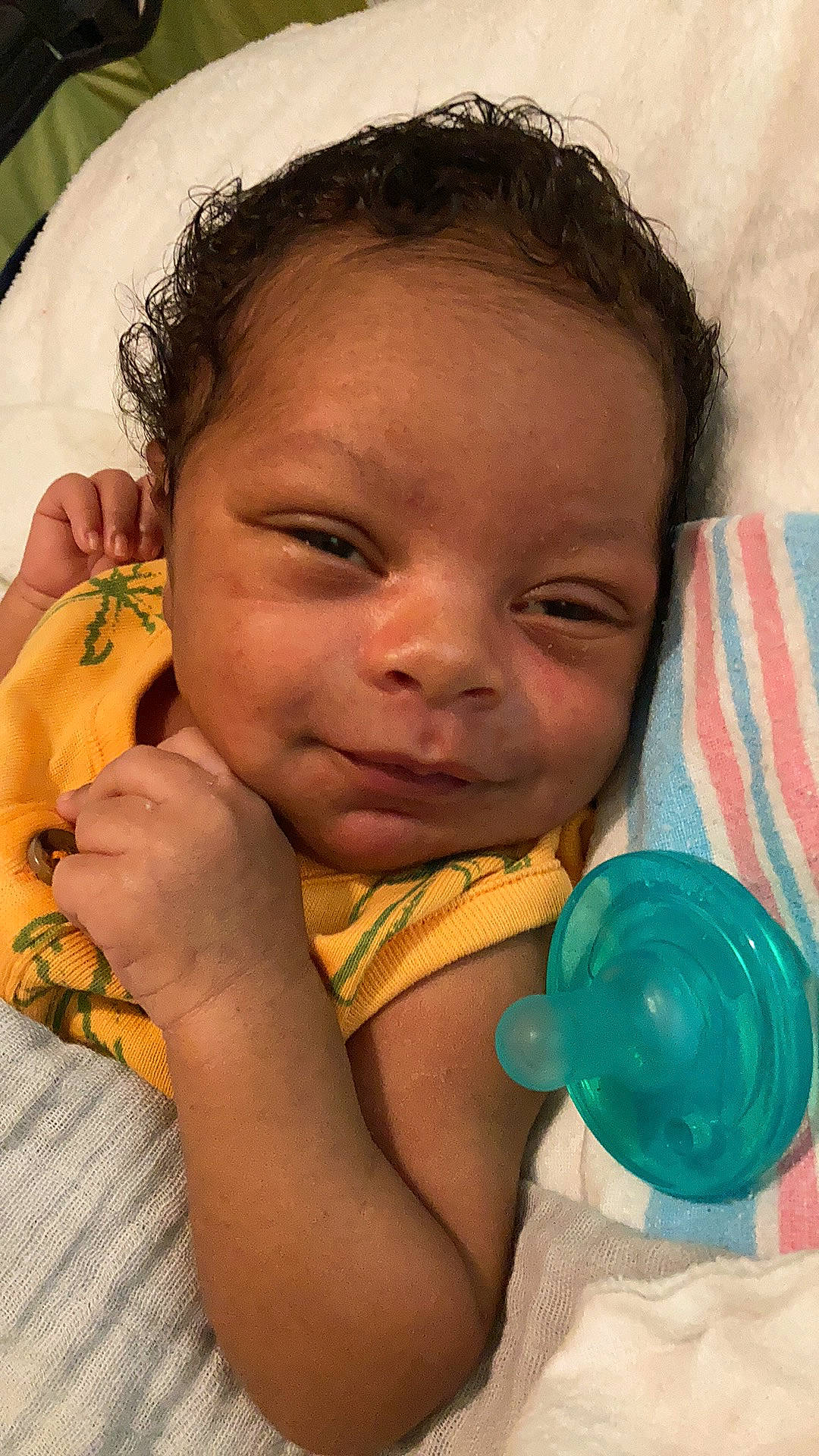 Richard is registered to the contest to win money with this photo: arm, baby, baby_toddler_clothing, cheek, eye, eyebrow, finger, forehead, gesture, hairstyle, happy, iris, lip, mouth, neck, nose, organ, person, skin, smile