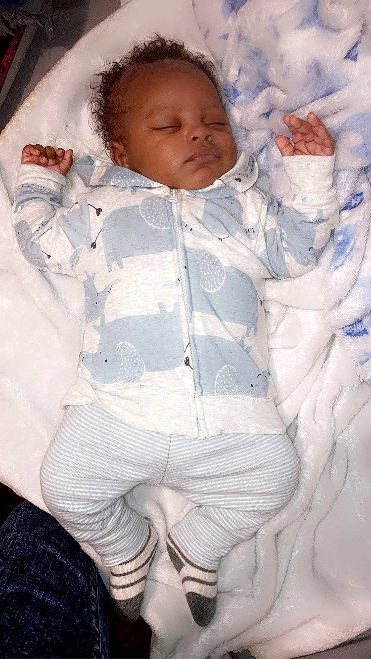 Richard is registered to the contest to win money with this photo: arm, baby, baby_sleeping, baby_toddler_clothing, cheek, child, comfort, eye, face, hand, head, human_body, iris, linens, mouth, nose, person, skin, sleeve, toddler