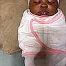 Niari is registered to the contest to win money with this photo: baby, sleeping, infant, blanket, pink, hat, bow, swaddle, cushion, soft, resting, peaceful, indoor, portrait, child, cute, face, headwear, newborn, cozy