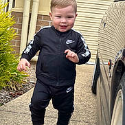 Brenn-Arthur is registered to the contest to win money with this photo: boy, car, casual, child, cute, driveway, fashion, footwear, greenery, happy, jacket, nike, outdoor, pants, person, sidewalk, smiling, sneakers, toddler, tracksuit