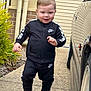 toddler, child, boy, nike, tracksuit, sneakers, greenery, car, driveway, sidewalk, smiling, outdoor, fashion, casual, cute, person, footwear, pants, jacket, happy