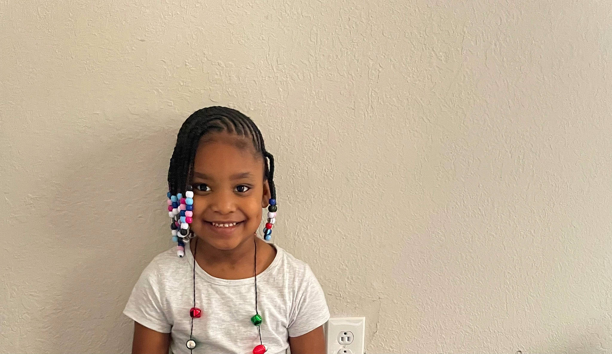 Caylee is registered to the contest to win money with this photo: audio_equipment, black_hair, cheek, chin, ear, eye, eyelash, facial_expression, flash_photography, fun, hair_tie, happy, hearing, jewellery, joy, neck, nose, person, sleeve, smile