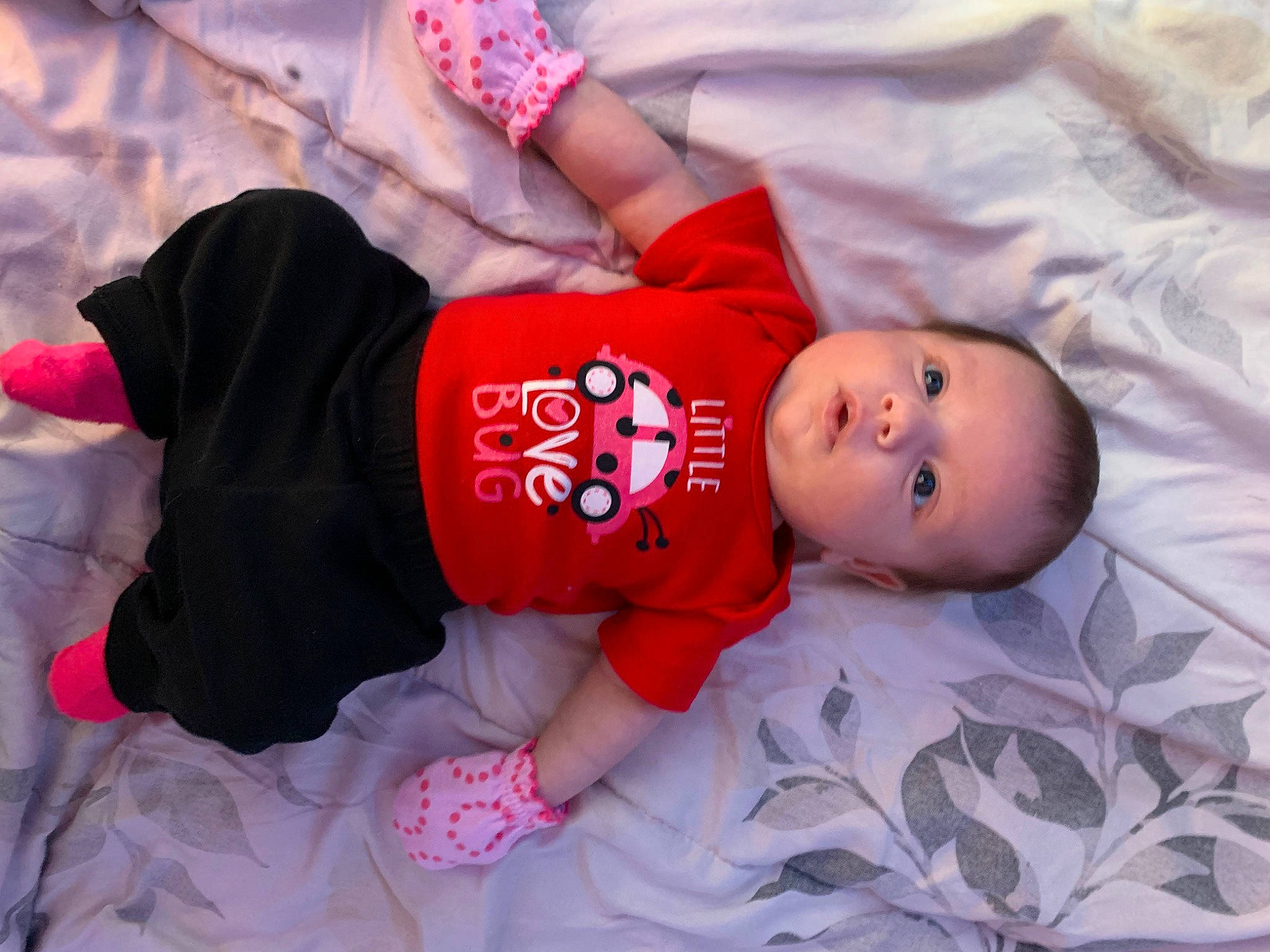 Amirah joined the competition — help win amazing prizes! baby, baby_toddler_clothing, child, comfort, eye, face, finger, hand, hat, mammal, mouth, pattern, person, pink, product, skin, sleeve, textile, toddler, tree