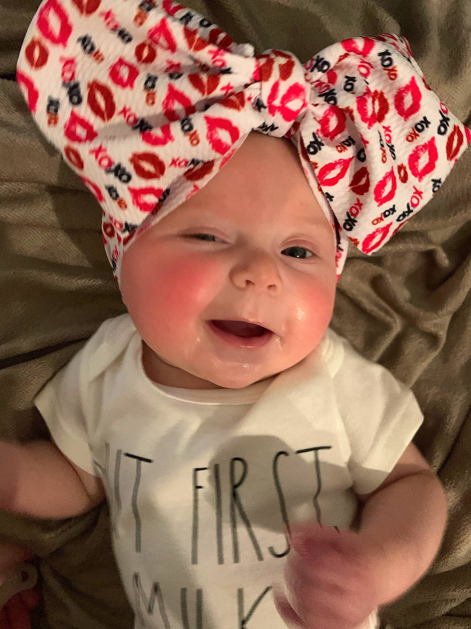 Charity is registered to the contest to win money with this photo: baby, baby_laughing, baby_toddler_clothing, cap, cheek, chin, eye, gesture, happy, hat, headgear, headwear, human, lip, mouth, person, pink, product, skin, sleeve