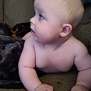Alucard joined the competition — help win amazing prizes! baby, child, infant, couch, blanket, arm, face, skin, expression, looking, indoors, furniture, curious, young, portrait, person, human, side_view, resting, comfortable