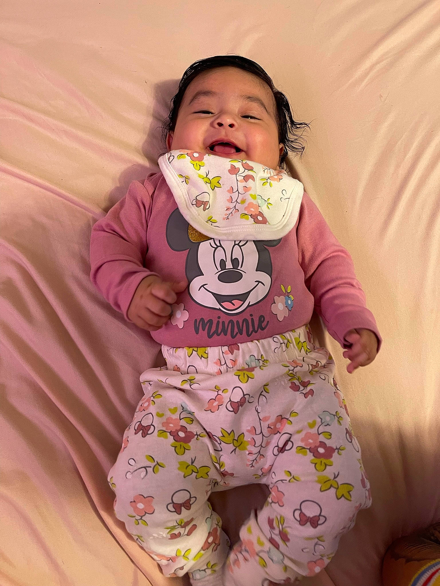 Aiyanna is registered to the contest to win money with this photo: baby_toddler_clothing, cheek, child, comfort, face, happy, linens, magenta, nightwear, pajamas, pattern, person, pink, play, sitting, skin, sleeve, smile, t_shirt, textile