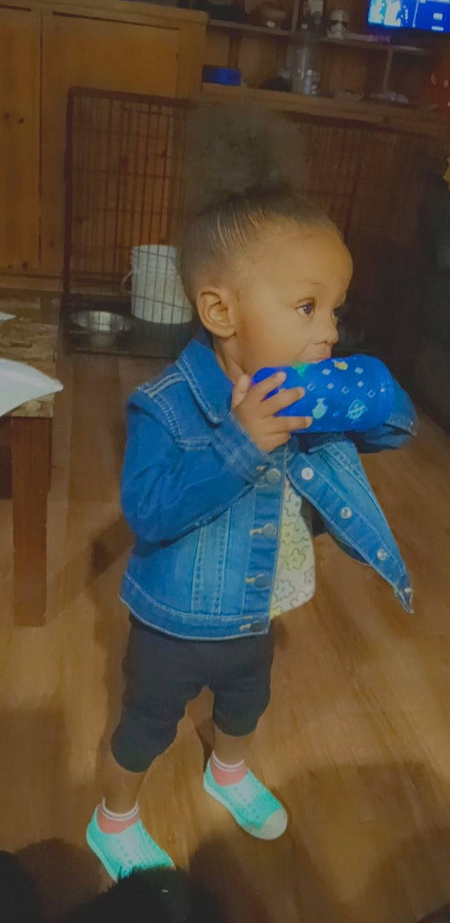 Amyia is registered to the contest to win money with this photo: baby, baby_products, baby_toddler_clothing, cheek, child, electric_blue, floor, flooring, fun, hardwood, head, iris, nose, pattern, person, room, sitting, skin, sleeve, toddler