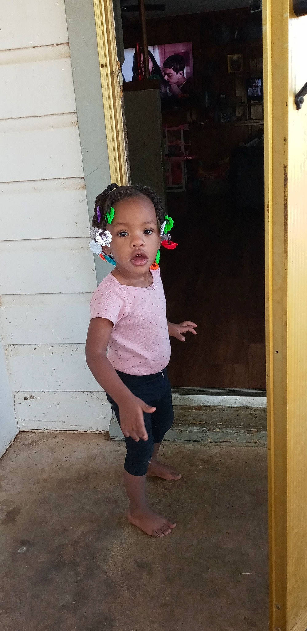 Amyia is registered to the contest to win money with this photo: baby_toddler_clothing, barefoot, child, door, floor, flooring, fun, happy, head, human_leg, leg, person, shoulder, sleeve, standing, t_shirt, tints_and_shades, toddler, trunk, waist