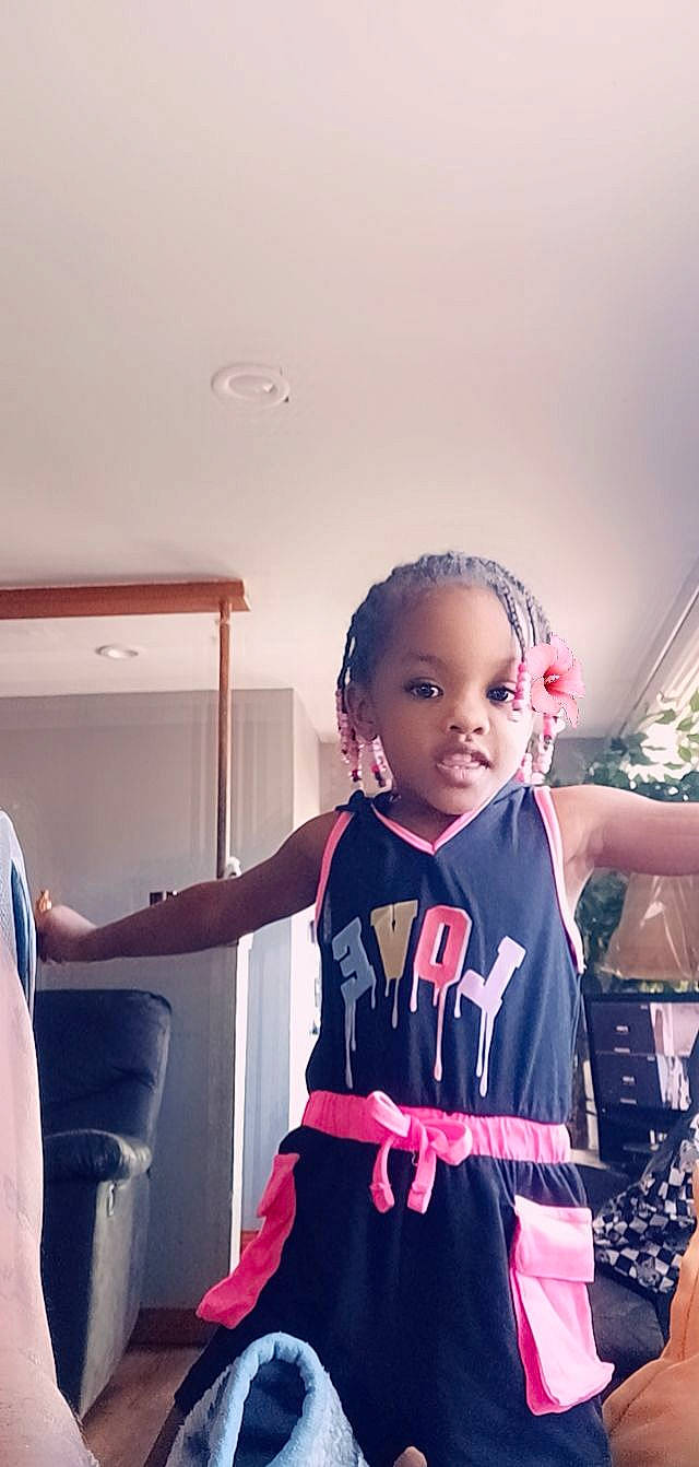 Amyia is registered to the contest to win money with this photo: baby, baby_toddler_clothing, chair, child, electric_blue, event, fashion_accessory, fashion_design, fun, happy, magenta, person, room, selfie, shoulder, sitting, sleeve, sportswear, standing, t_shirt