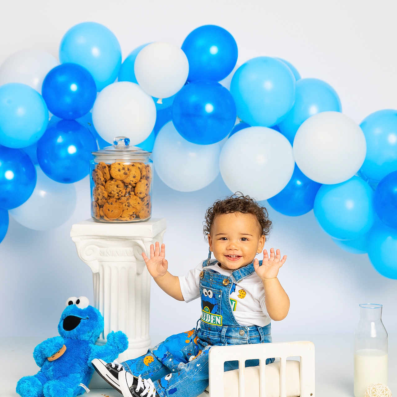 Kayden is registered to the contest to win money with this photo: baby, balloon, beverage, clothing, cream, face, food, footwear, fun, furniture, head, indoors, milk, party, people, person, photography, portrait, shoe, sphere