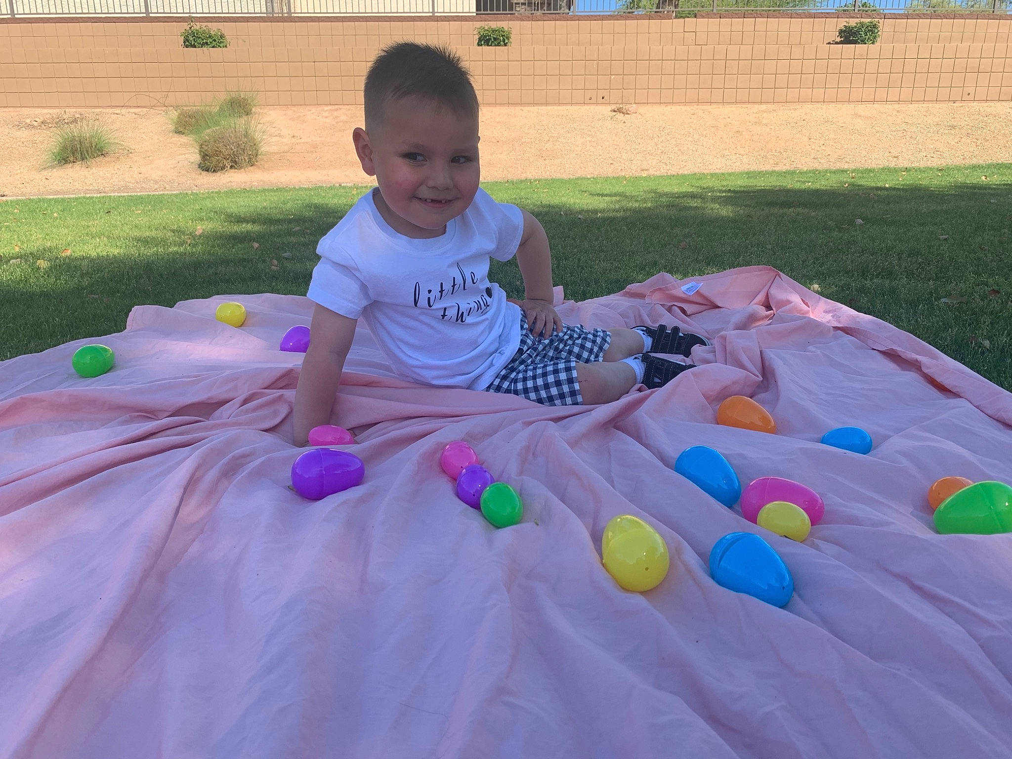 Alexx joined the competition — help win amazing prizes! child, event, fun, games, grass, happy, inflatable, joy, leisure, magenta, outdoor_recreation, party_supply, person, plant, play, public_space, recreation, shorts, sitting, smile