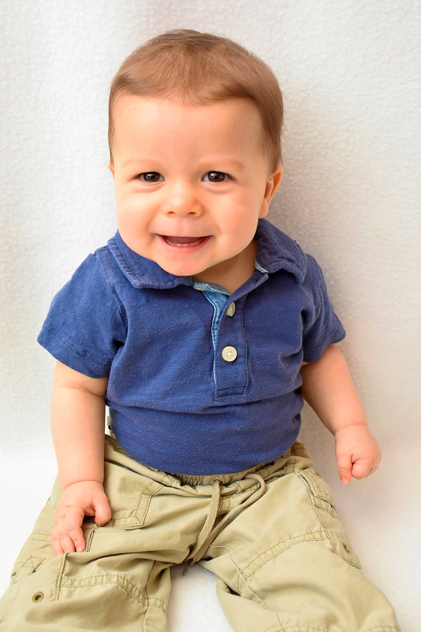 Cody is registered to the contest to win money with this photo: arm, baby, baby_toddler_clothing, cheek, child, collar, dress_shirt, electric_blue, happy, joint, joy, khaki_pants, neck, organ, person, shoulder, skin, sleeve, smile, standing