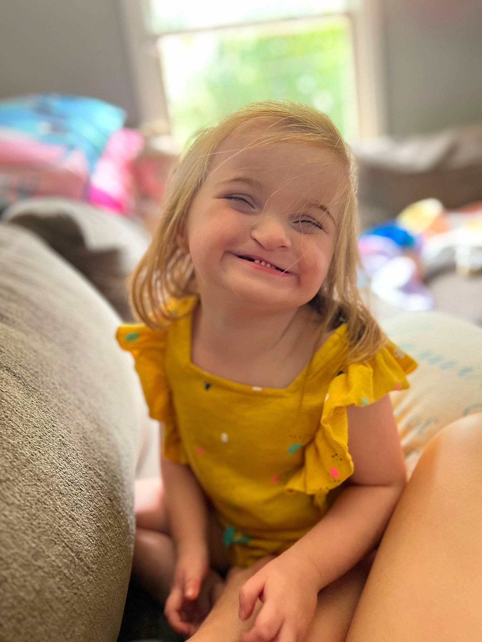 Fallon joined the competition — help win amazing prizes! cheek, child, comfort, eye, face, fun, happy, human_body, human_leg, joy, knee, leisure, person, play, recreation, room, sitting, skin, smile, thigh