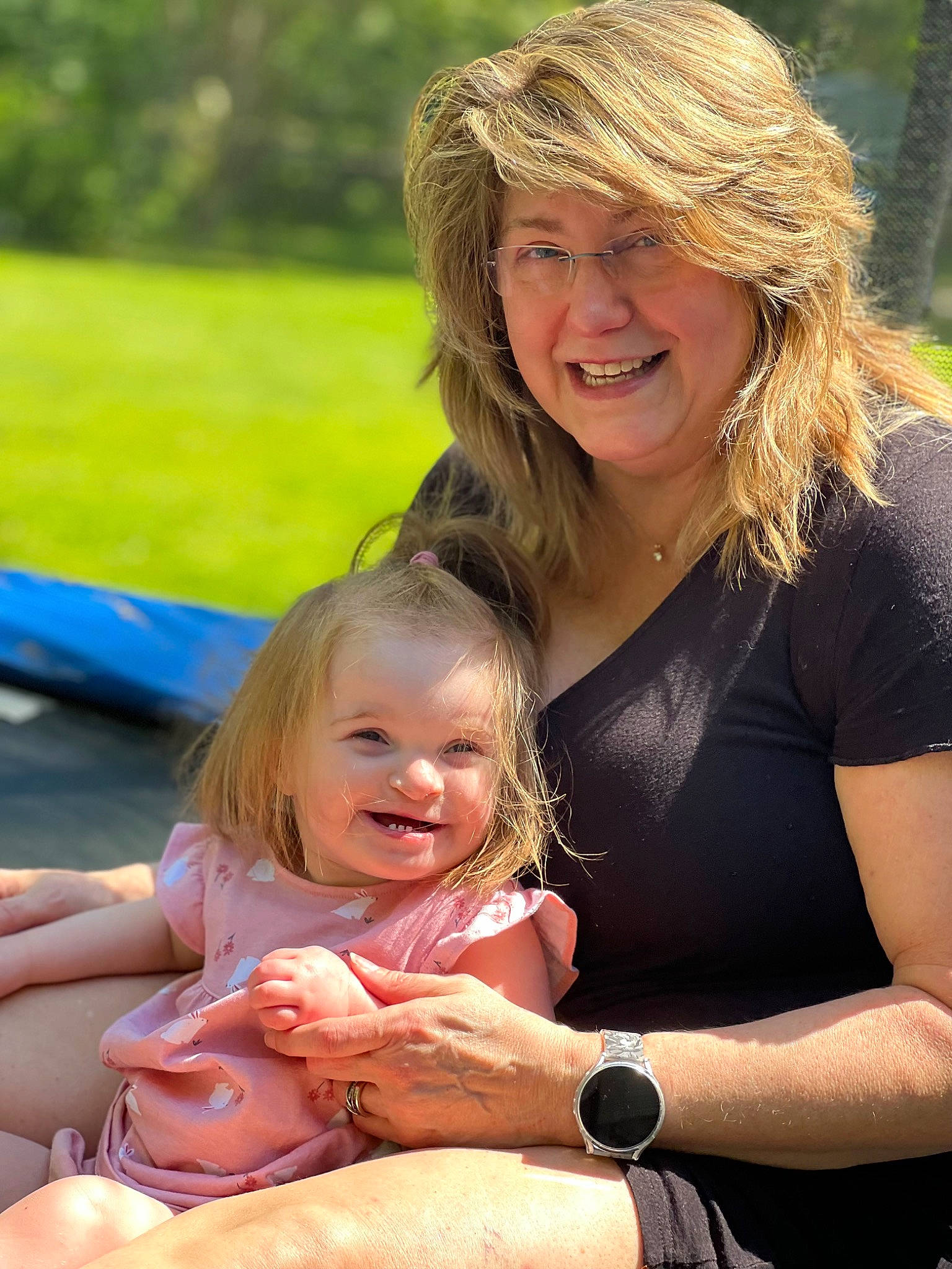 Fallon joined the competition — help win amazing prizes! cap, child, event, facial_expression, fun, grass, hairstyle, hand, happy, joy, lap, leisure, people_in_nature, person, photograph, recreation, sitting, skin, smile, summer