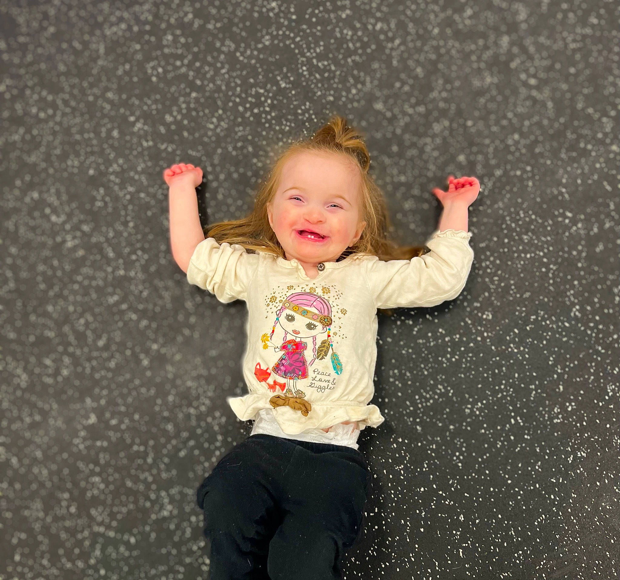Fallon joined the competition — help win amazing prizes! arm, asphalt, baby_toddler_clothing, child, face, flooring, fun, gesture, grass, happy, leg, people_in_nature, person, road_surface, sleeve, smile, standing, t_shirt, thumb, toddler
