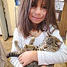 Percy joined the competition — help win amazing prizes! child, girl, cat, kitten, indoor, smile, holding, tabby_cat, long_hair, white_shirt, carpet, drawing, wall, door, cozy, portrait, happy, cute, pet, home