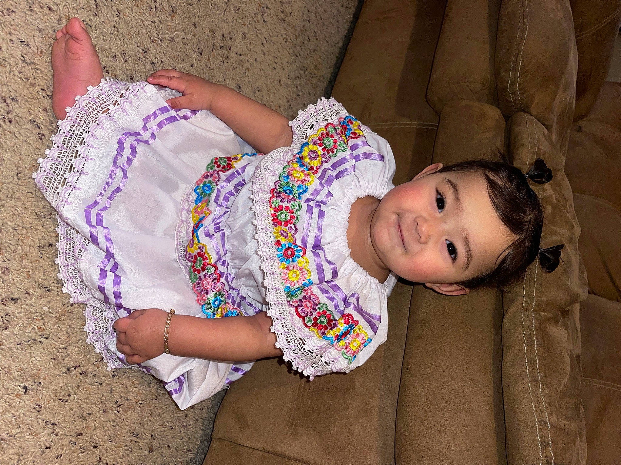 Lenaya is registered to the contest to win money with this photo: baby_toddler_clothing, child, day_dress, eyelash, facial_expression, fun, happy, human_body, human_leg, joint, magenta, pattern, person, pink, portrait_photography, sitting, skin, sleeve, thigh, toddler