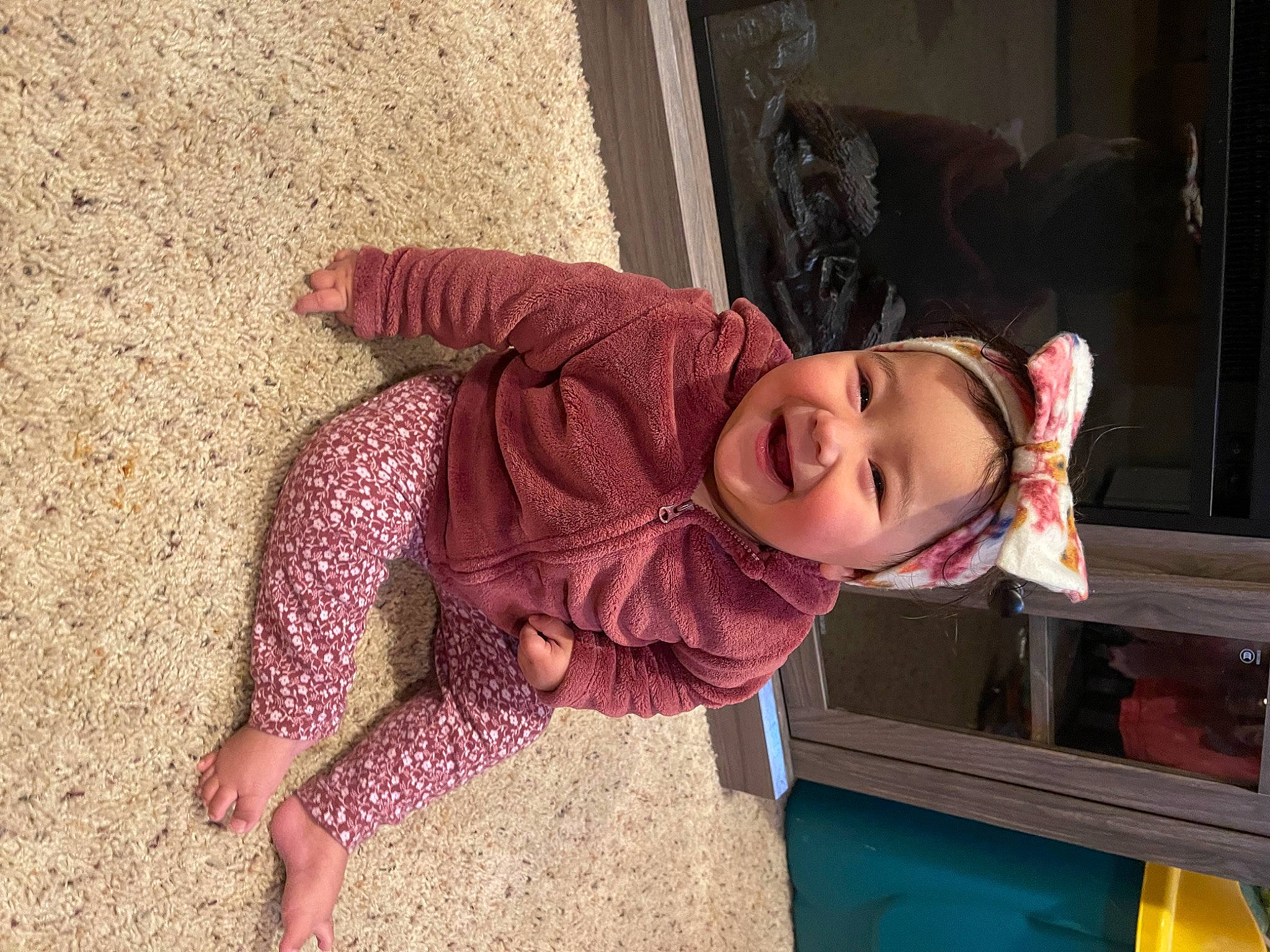 Lenaya is registered to the contest to win money with this photo: automotive_exterior, baby_toddler_clothing, child, city, fun, happy, jacket, joy, leisure, magenta, person, play, sitting, skin, sleeve, smile, soil, sunglasses, toddler, tree