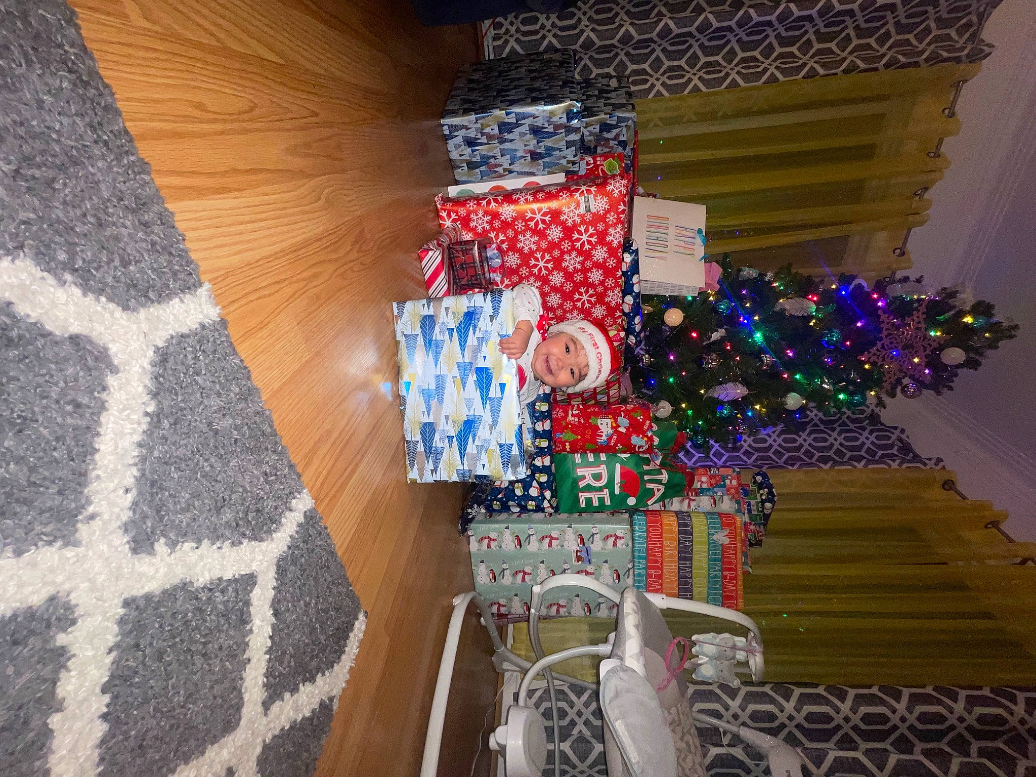 Lenaya is registered to the contest to win money with this photo: building, christmas_decoration, christmas_ornament, christmas_tree, decoration, electric_blue, event, flooring, headwear, holiday, holiday_ornament, house, joy, linens, living_room, ornament, person, plant, room, textile