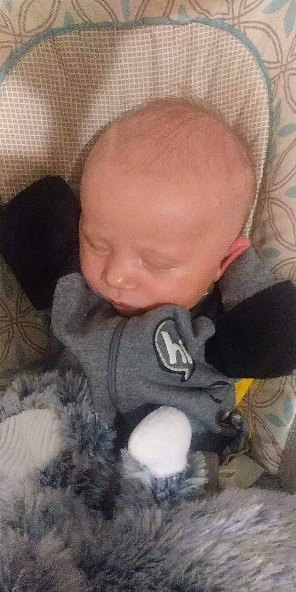 Grayson is registered to the contest to win money with this photo: baby, cheek, child, face, forehead, head, nap, nose, person, skin, sleep, smile, toddler