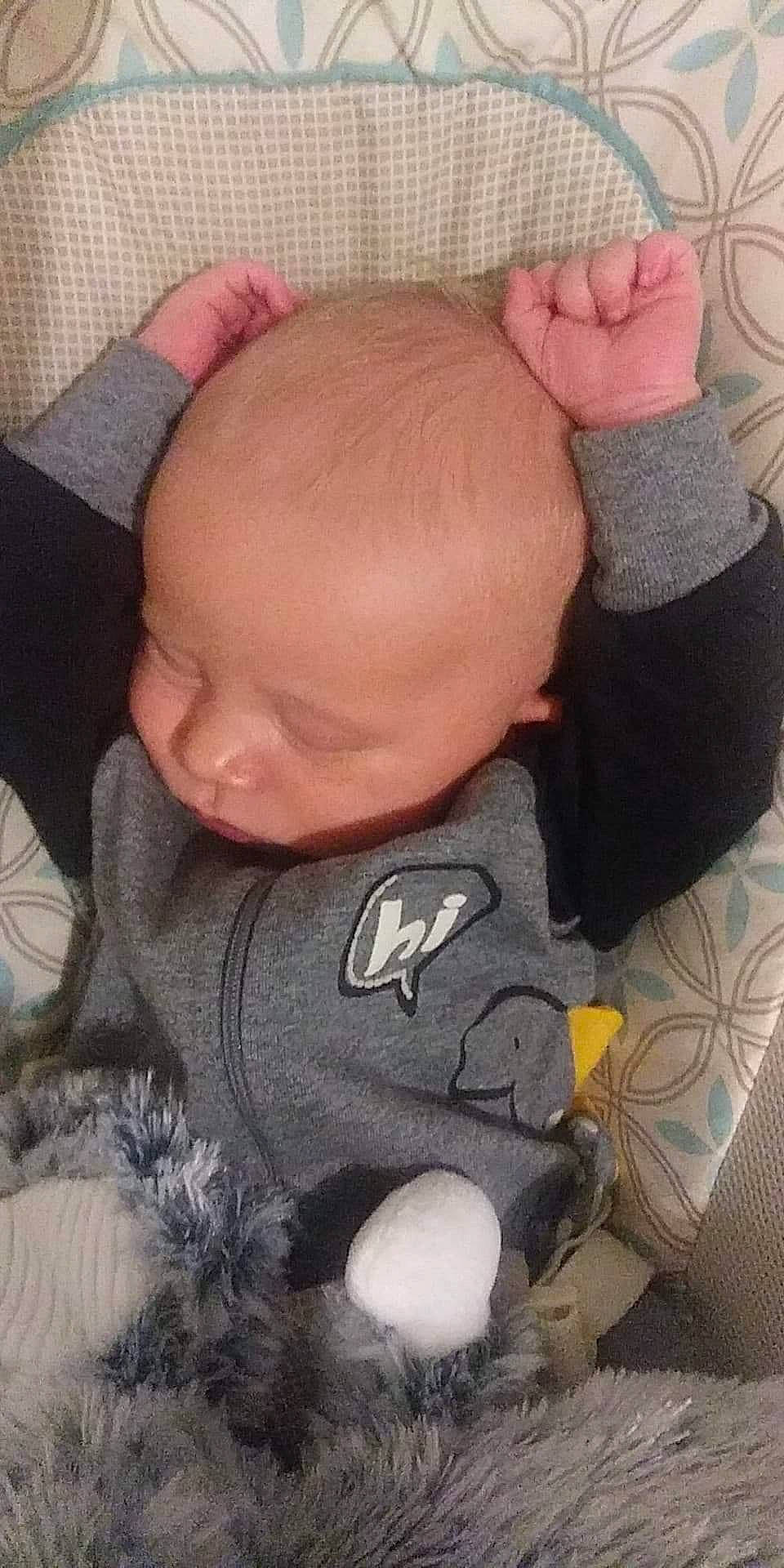 Grayson is registered to the contest to win money with this photo: arm, baby, cheek, child, ear, face, finger, forehead, hair, hand, head, leg, mouth, nap, nose, person, skin, sleep, toddler